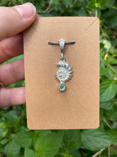 Load image into Gallery viewer, Sterling Silver Nautilus Shell With Faceted Blue Topaz Pendant